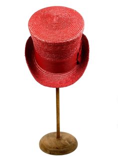 Straw Top hat in red. Made with 8/9 millimeters natural red straw braid and embellished with a 70 millimeters wide red grosgrain ribbon. Measurements in centimeters are 33 x 24. Crown height 13.5. Brim length 7. These measurements may have some slight variation depending on the size of the hat. For its elaboration we only use very good quality and resistant straw braids. In our workshop in the Pyrenees we sew and work one by one our hats with wooden molds of our own design. For other sizes, plea Red Straw Hat For Spring, Red Adjustable Brimmed Straw Hat, Adjustable Red Brimmed Straw Hat, Fitted Red Brimmed Top Hat, Adjustable High Crown Mini Hat In Red, Vintage Red Brimmed Top Hat, Red Adjustable Top Hat For Kentucky Derby, Adjustable Red Top Hat For Kentucky Derby, Adjustable Brimmed Red Mini Hat