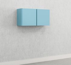 a blue cabinet is on the wall next to a white floor and a gray wall