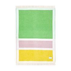 a green, yellow and pink towel on a white background