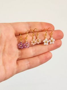 Crystal Daisy Dangle Earrings Inspired by dainty daisies, these cute dangle earrings are the perfect addition to your look. Ideal for those who love a floral design and drop style earrings. Makes for a lovely custom gift or a present for yourself! DETAILS Materials: Glass crystals, Gold color wire and beads If you have any questions send me a message so we can chat! 🥰 Nickel-free Dangle Flower Earrings For Her, Nickel-free Dangle Flower Earrings Gift For Her, Dainty Hypoallergenic Flower Earrings, Dangle Crystal Earrings With Flower Charm As Gift, Flower Shaped Crystal Earrings With Flower Charm For Gifts, Flower Shaped Crystal Earrings With Flower Charm, Flower-shaped Crystal Earrings With Flower Charm As Gift, Delicate Dangle Flower Charm Earrings, Flower-shaped Crystal Earrings With Flower Charm