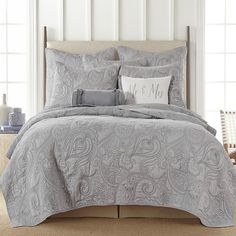 the comforter is neatly made and ready to be used in the bedroom or as an accent piece