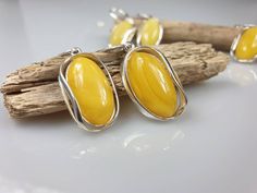 Big white Amber earrings - 1 pair.. Natural butterscotch Baltic Amber. Each pair can be slightly difderent colour due to amber is being natural. Handmade earrings. Sterling silver 925, with stamps. Earrings length about 4 cm. A matching pendant is also available. Handmade Yellow Earrings For Formal Occasions, Yellow Handmade Earrings For Formal Occasions, Yellow Baltic Amber Earrings, Earrings Hanging, Amber Earrings, Gift For Mother, Amber Jewelry, Earrings Sterling Silver, Baltic Amber