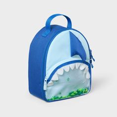 Carrying lunch to school, picnics or road trips will be so much more fun for your child with this Shark Fashion Lunch Bag from Cat & Jack™. This lunch tote features a single zippered compartment to hold anything from snacks and sandwiches to fresh fruit. It also features a mesh pocket on the inside and an outer zip pocket for added storage space, and a tote handle makes it easy to carry. Made from 100% recycled polyester and featuring a dome-shaped silhouette, it features a shark fin accent on t Playful Bags With Zipper Closure For Back To School, Playful Back To School Bag With Zipper Closure, Playful Bag With Zipper Closure For Back To School, Playful Back To School Bags With Zipper Closure, Back To School Lunch Bag Backpack With Zipper, Back To School Lunch Bag With Zipper, Cute Lunch Box For Travel And Back To School, Cute Lunch Box For Back To School Travel, Playful Back To School Lunch Box