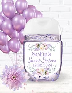 a jar with some balloons in it next to a bunch of purple and white flowers