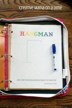 an open notebook with the word hangman written on it