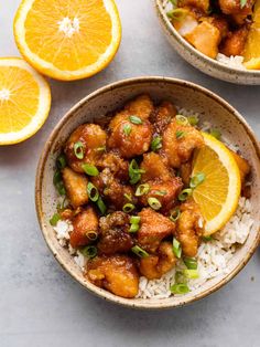 two bowls filled with orange chicken and rice