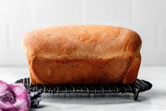 a loaf of bread sitting on top of a cooling rack