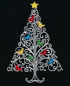 an embroidered christmas tree with birds on it