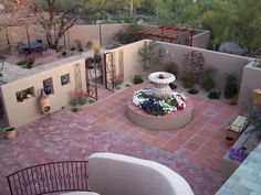 an aerial view of a courtyard and patio area