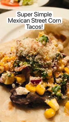 mexican street corn tacos on a plate with the title super simple mexican street corn tacos