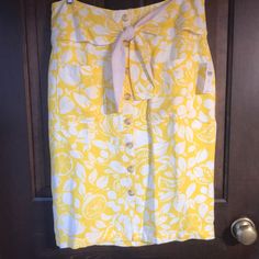 Never Been Worn, With Tags, Yellow And White Floral And Lemon Print Skirt. Non Useable Attached Buttons In The Front With Knot Tie At Waist. Zipper In The Back. Super Cute With A Plain White Tee! Knot Tie, Plain White Tee, Anthropologie Skirt, Lemon Print, White Skirt, Print Skirt, Tie Knots, Plain White, White Tee