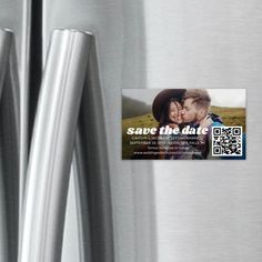 an advertisement on the side of a refrigerator for save the date with two people kissing each other