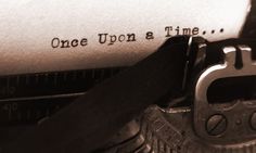 an old typewriter with the words once upon and time written on it's paper