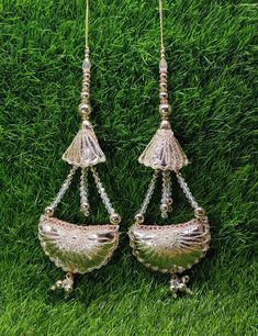 Indian Handmade Silver Latkan for Saree Blouse Lehenga HandBags Dupatta Decoration Bridal Wedding dress for Women pair of 2 pcs Size - 21.0 cm Length  Item Description You can use this Beautiful pair of tassle for several DIY projects.  *These beautiful Tassel Latkans are used as the accessory for saree blouse on the back, but u can use according to your need and your innovative ideas. * Package contains 2 Latkan / 1 Pair Other Than Saree Blouse, you can use these latkans in various ways Craft Projects Designing Home Decoration Festive celebrations. Evening and party Apparels. Home décor items Apparel & Fashion Scarves n Stoles Headband, hats Table cover, curtains, Pillow covers, Cushion cover Shoe designing Headband, hats Table cover, curtains Designing stylish blouses Ship From New Delhi Cheap Wedding Chandbalis With Latkans, Saree Bluse, Wedding Dress For Women, Sari Lehenga, Blouse Lehenga, Bridal Wedding Dress, Innovative Ideas, Stylish Blouse, Bridal Wedding Dresses