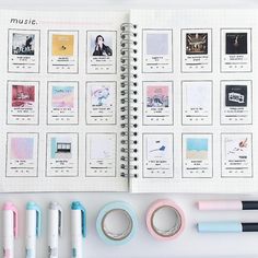 an open planner with various items on it and some pens next to it in front of the pages