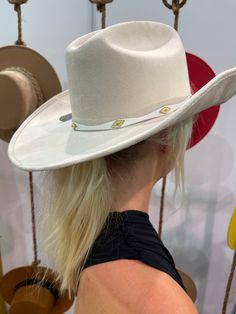 A fabulous and on trend cowboy hat that’s embellished with our exclusive crystal band around the crown. Meet the Shania Cowboy Hat! The best part? It's adjustable with an inner tie so it will fit most EVERYONE. THE HAT:-Cowboy style hat-Crystal trim around the crown-- OMG YES-Gorgeous color-Holds it's shape amazingly White Western Fedora For Kentucky Derby, White Fedora For Rodeo And Kentucky Derby, White Western Felt Hat For Kentucky Derby, White Hat Bands For Kentucky Derby Country Events, White Felt Hat For Western-themed Events At Kentucky Derby, White Felt Hat For Western-themed Events, Kentucky Derby, White Hats For Western-themed Events, Elegant White Hat Bands For Rodeo, Elegant White Hat Band For Rodeo