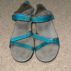 Waterproof Sandals That Are Practically Brand New. They’ve Only Been Worn A Couple Of Times. Straps Are In Great Condition As Well As The Rest Of The Sandals. You Will Not Be Disappointed With How Comfy Sandals Are. They Are A Light Grey Color With Teal Straps. Blue Open Toe Sport Sandals For Hiking, Blue Sport Sandals For Summer Hiking, Blue Round Toe Hiking Sandals, Waterproof Sandals, Light Grey Color, Comfy Sandals, Teva Shoes, Water Proof, Grey Color