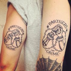 two arm tattoos with chains and hammers on them, one is holding a wrench