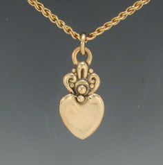 "P750- 14k Yellow Gold Heart Pendant, Handmade One of a Kind. Has a 18\" 14/20 Yellow Gold Filled chain with Lobster Claw Closure. Pendant measures: 25 mm L x 12 mm W. It is made using the Lost wax method of casting, where I made the design in wax and then cast it into silver. To learn more about this process and Me please visit my website at: https://www.denimanddiamondjewelry.com Thanks for stopping by, come back often. Patti" Yellow Gold Heart Necklace, Ethiopian Opal Necklace, Gold Heart Pendant, Heart Pendant Gold, Casual Jewelry, Casting Jewelry, Gold Heart Necklace, Pretty Jewelry, Lost Wax