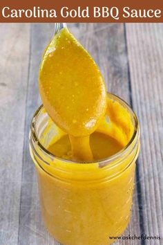 a spoon full of yellow bbq sauce on top of a wooden table with text overlay