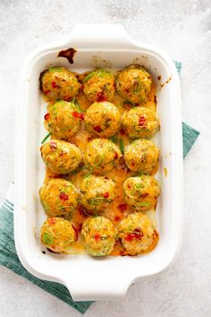 a casserole dish filled with broccoli covered in cheese and other toppings