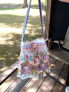 I just love all the sweet colors and patterns of vintage hankies. Years ago, I used them to design the bodices of bridesmaids' dresses. Now, I'm ruffling them to make one-of-a-kind shabby boho chic shoulder/crossbody bags. This bag features hankies in vibrant shades of purple, blue, and yellow flowers. I've trimmed the top with ribbons and laces in matching purple and yellow and topped it off with a hydrangea blossoms. The back of the bag features lace with a lavender, yellow, and green plaid sl Bohemian Upcycled Multicolor Shoulder Bag, Bohemian Multicolor Floral Print Bag, Bohemian Tote Shoulder Bag With Floral Print, Bohemian Upcycled Tote Shoulder Bag, Bohemian Shoulder Bag With Floral Print Tote, Bohemian Floral Print Tote Shoulder Bag, Bohemian Floral Print Shoulder Bag For Daily Use, Vintage Summer Shoulder Bag With Adjustable Strap, Bohemian Purple Shoulder Bag With Adjustable Strap