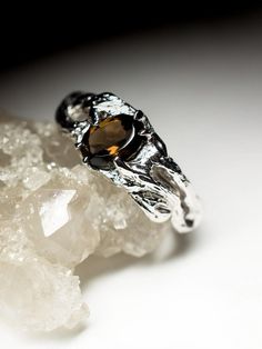 Silver ring with natural Smoky Quartz quartz origin - Brazil stone weight - 0.7 carats average ring weight  - 2.96 grams available ring sizes - 4; 4.5; 5.25; 6; 6.25; 6.5; 7; 7.5; 7.75; 8.25; 8.75 US  stone measurements - 0.12 x 0.2 x 0.28 in / 3 х 5 х 7 mm ref No 9296 Worldwide shipping from Berlin, Germany White Gold Citrine Promise Ring, Solitaire Citrine Ring For Anniversary, Citrine Gemstone Promise Ring, Citrine Prong Setting Promise Ring, Citrine Promise Ring With Prong Setting, Promise Ring With Citrine Center Stone, Citrine Gemstone Ring With Round Cut, Citrine Promise Rings With Round Cut, Nature-inspired Diamond Rings With Gemstones