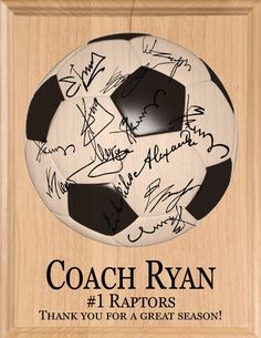 a soccer ball with the words coach ryan on it is in a wooden plaque that reads, thank you for a great season