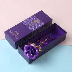 an open purple box with a flower in it