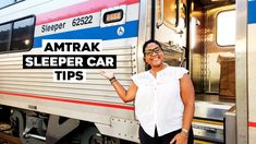 a woman standing next to a train with the words amtrak sleeper car tips on it