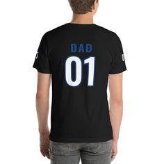 "This t-shirt is everything you've dreamed of and more. It feels soft and lightweight, with the right amount of stretch. Great for sports lover dads, the jersey-like shirt features the number \"01\" and the title \"dad\" on the front and back. As an added detail, number 01 insignia is printed on both sleeves. Makes a wonderful Father's Day,  birthday or just because gift for best dads, new dads and all dads! * 100% combed and ring-spun cotton (Heather colors contain polyester) * Athletic and Bla Relaxed Fit Jersey T-shirt With Letter Print, Team Spirit Jersey T-shirt With Letter Print, Jersey T-shirt With Letter Print In Team Colors, Sporty Relaxed Fit T-shirt For Fan Gear, Sports Fan Jersey T-shirt With Team Name, Short Sleeve Jersey T-shirt For Team Spirit, Jersey Short Sleeve T-shirt For Fan Gear, Sports Jersey Tops With Name Print, Jersey Tops With Name Print For Game Day