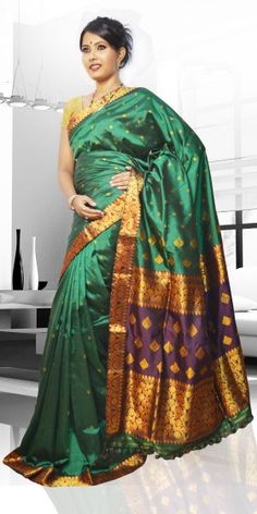 Beautiful Green Colour Pat Guna Contrast Assam Silk Saree with artistic Guna work of small buta giving an unique look to the collection. This saree can be used as both wedding and festival Saree.The Saree comes with matching blouse piece, the blouse shown in the image is just for display purpose.Slight colour variation may be there in display & actual. The Collection