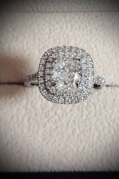 an engagement ring in a box with diamonds on it