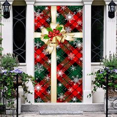 a christmas door with a bow and snowflakes on it