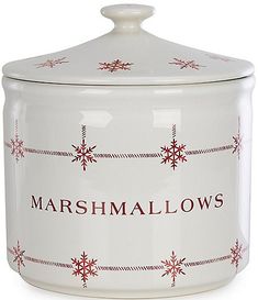 a white ceramic jar with red snowflakes on the lid and words marshmallows