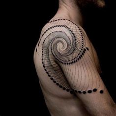 a man's arm with a spiral tattoo on it