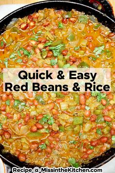 a skillet filled with beans and rice on top of a wooden table