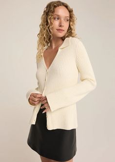 Elevate your look in our collared long sleeve sweater, featuring soft ribbed sweater yarns and a classic button-up front. Perfect for layering or wearing solo, this piece combines comfort and style effortlessly. Collared. Long sleeve. Midweight. Regular fit. Dancer Yarns - 2X2 Rib: 52% Viscose, 26% Polyester, 22% Nylon. Model is wearing a size S. Button Up Sweater, Black Leather Skirts, Cardigan Sweater Dress, Denim Jumpsuit, Sweater Blouse, Ribbed Sweater, Scarf Hairstyles, Sea Salt, Sleeve Sweater