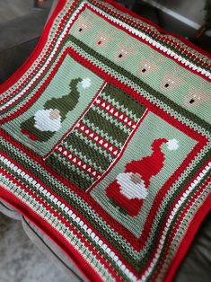 a red and green knitted christmas afghan