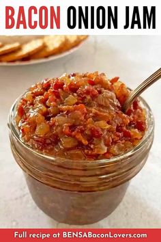 bacon onion jam in a glass jar with a spoon