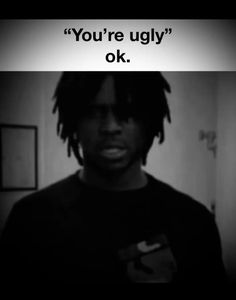 a man with dreadlocks standing in front of a mirror that says, you're ugly ok