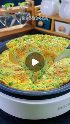 an omelet is being cooked in a pan