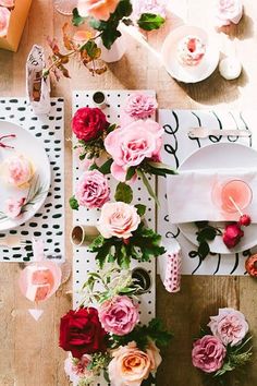 the table is decorated with pink and red flowers