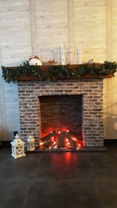 a brick fireplace with christmas decorations on top