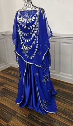 Blue Kaftan For Traditional Ceremonies, Blue Sequined Kaftan For Festive Occasions, Blue Sequined Kaftan For Eid, Festive Blue Sequined Kaftan, Blue Traditional Drape Kaftan For Wedding, Blue Kaftan For Festivals And Parties, Blue Kaftan For Party Festivals, Silver Traditional Drape Dress For Eid, Silver Bollywood Dress For Eid