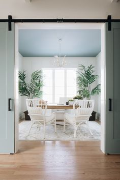 the instagram page on instagram shows an image of a dining room with white chairs and