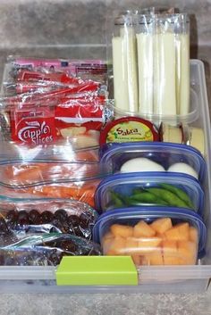 several containers filled with food sitting on top of a counter