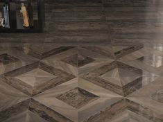 the floor is made up of many different shapes and sizes, including an intricate pattern