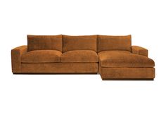 a large brown couch sitting on top of a white floor