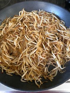 the food is being cooked in the pan on the stove top and ready to be eaten